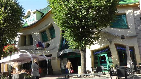 The crooked house is an unusually shaped building. Krzywy Domek - Crooked House - Sopot Poland - YouTube