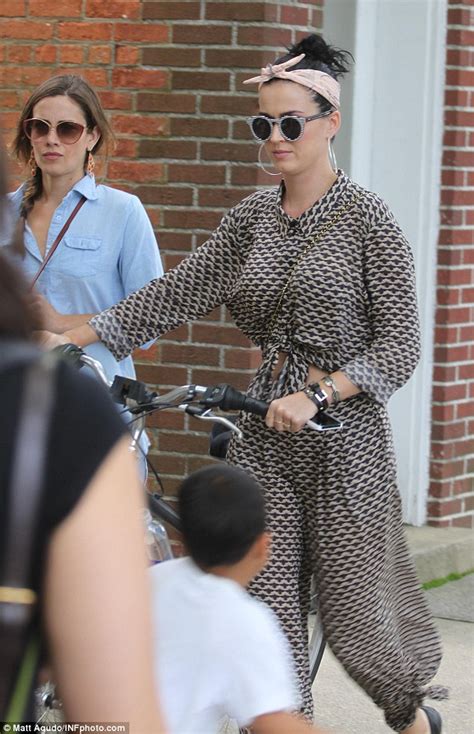Katy Perry Chooses Fashion Over A Work Out As She Walks Her Bike Around The Hamptons Daily