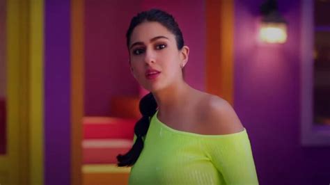 sara ali khan in ₹57k one shoulder mini dress shows how to do neon look right fashion trends