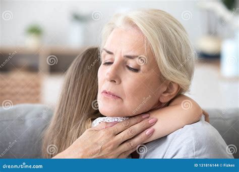 Loving Sad Grandmother Embracing Little Girl Comforting Supporti Stock