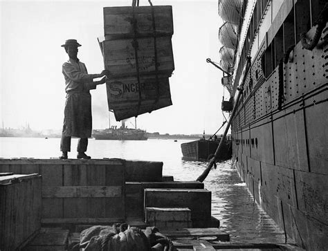 Unloading A Cargo Ship Photograph By Underwood Archives Pixels
