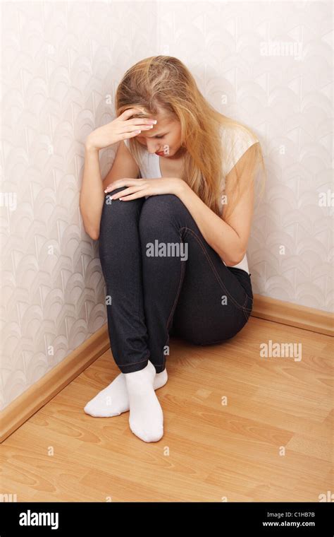 Scared Abused Woman Sitting In The Corner Of The Room Stock Photo Alamy