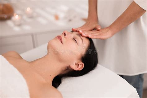 Crop Anonymous Masseuse Doing Face Massage To Female Customer In Salon Stock Image Image Of