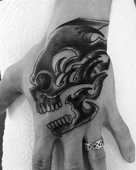This is a maori tribal tattoo that is dominated by black and bold spirals known as 'koru'. 50 Tribal Skull Tattoos For Men - Masculine Design Ideas