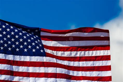 Close Up Of A New American Flag With A Blue Sky Stock Photo Image Of