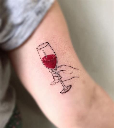 Glass Of Wine In Hand Tattoo By Ana Maturana