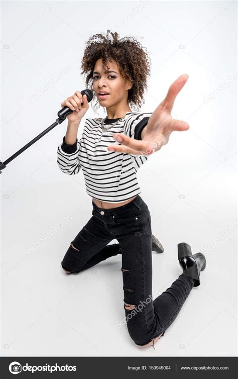Young Singer With Microphone — Stock Photo © Dmitrypoch 150949004