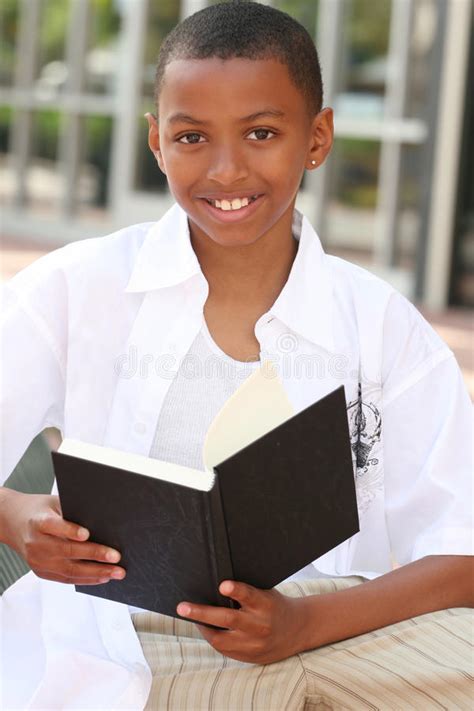 African American Teenager Boy Reading A Book Stock Image Image Of