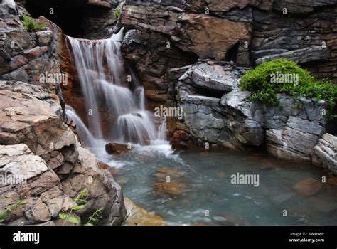 A Waterfall Over Rocks Taken With A Slow Shutter Speed To Cause The