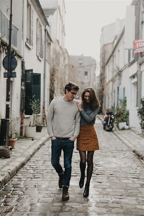 Cute Couple Walking Down Cobblestone Street In Paris Stocksy United
