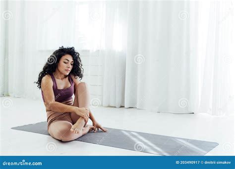 Beautiful Woman Brunette Yoga Asana Stretching The Flexibility Of The