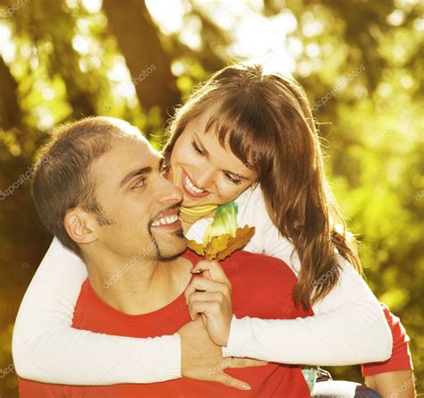 Young Couple In Love Outdoors — Stock Photo © Nejron 1422362