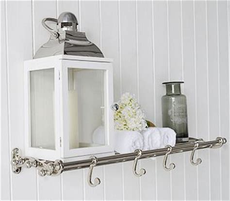 Furnishing the bathroom with accessories that match the shape and style of the surrounding environment allows to make use of a well arranged space and one with a strong aesthetic impact. Chrome bathroom shelf with hooks for hanging coats ...