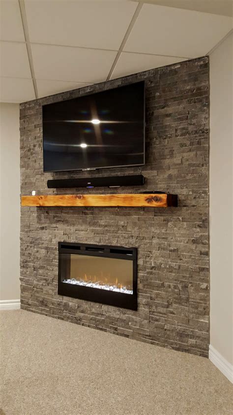 Germano Creative Interior Contracting Ltd Finished Basement Featuring Ledge Stone Fireplace