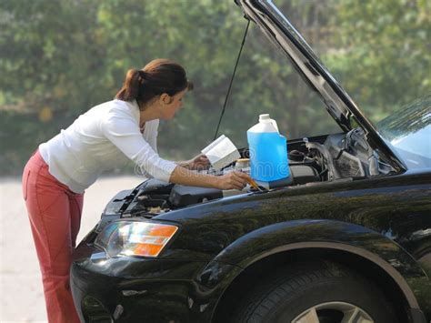 Woman Trying To Fix The Car Stock Photo Image Of Reading Manual 3502410