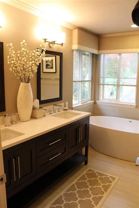 And for more great upgrades for your home, check out these 20 amazing home decor items from walmart. Warm toned #bathroom with furniture-style vanity. Visit ...