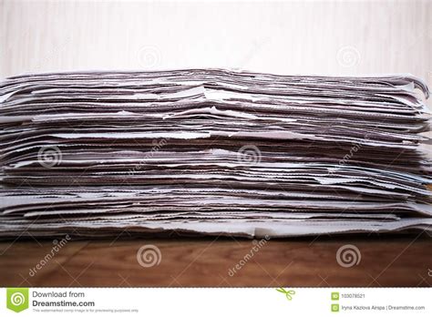 Newspapers Folded And Stacked On The Wooden Table Stock Image Image