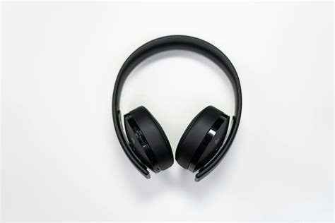 Black Wireless Headphones On White Surface · Free Stock Photo