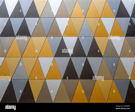 Triangular Geometric Pattern Of Triangles On Cladding Of A Wall Stock