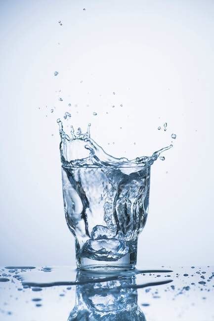 Water Splashing Into A Glass — Close Up Stock Photo 154982366