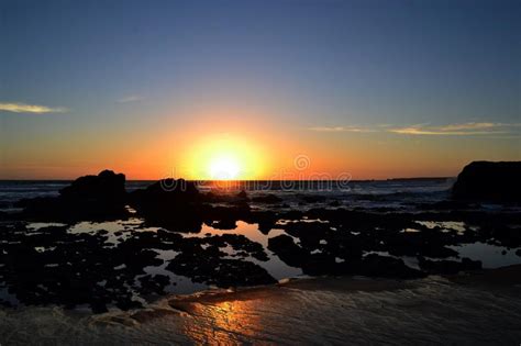 Golden Sunset At A Beach With Rocks And Rock Pools Stock Image Image