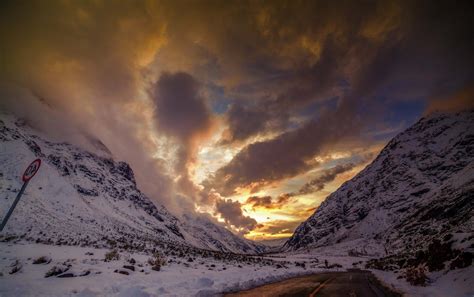 1280x768 Sunset Clouds Winter Road Snow Hill Yellow Red Light Blue