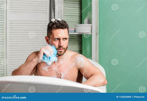 Man Handsome Muscular Guy Relaxing In Bath Spa Wellness Concept