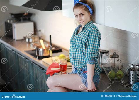 A Cute Young Girl In The Kitchen Prepares Food Stock Image Image Of Lady Home 126697713