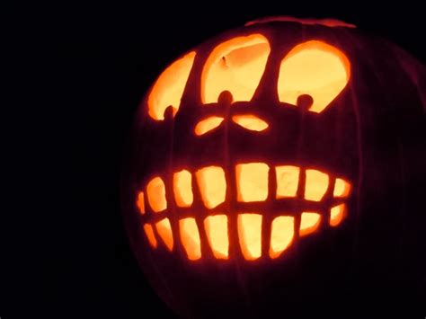 Carved Three Eyed Alien Halloween Pumpkin