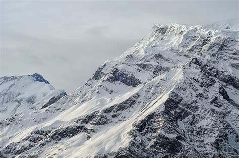 Gorgeous Snowy Mountain Peak Of Himalayas In A Dim Evening Light By