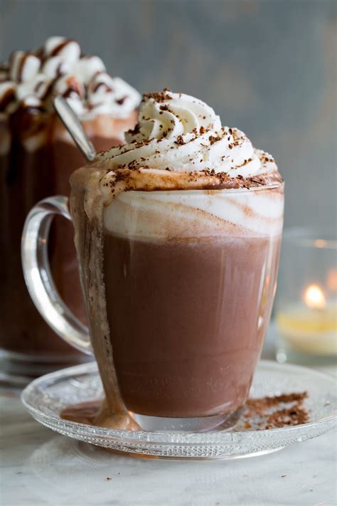 Hot Chocolate Shown Here In A Glass Mug With Whipped Cream And Chocolate Shavings O Hot