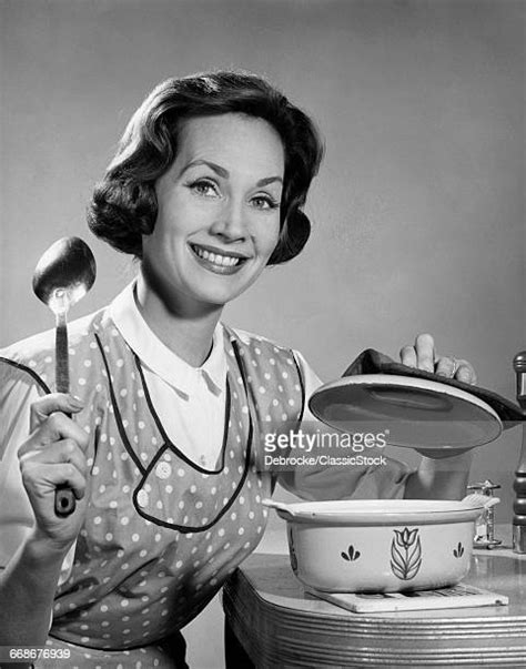 1960s Woman Wearing Apron In Kitchen Photos And Premium High Res