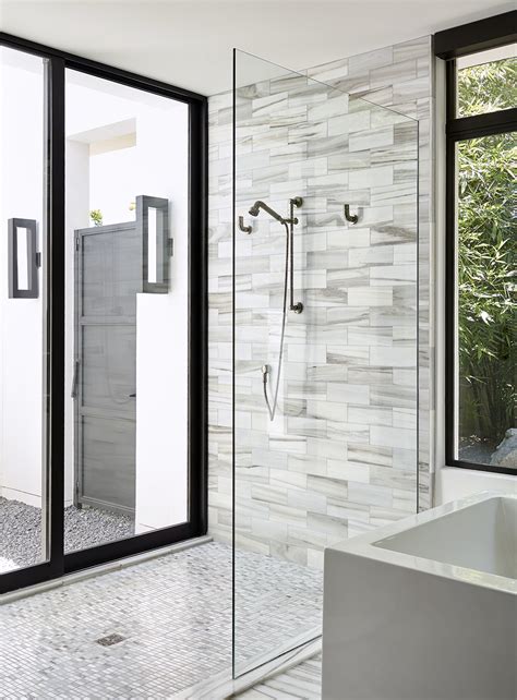 A shower of glass in a modern bathroom creates an understated elegance. How to Clean Glass Shower Doors: 7 Natural Cleaning Tips | Better Homes & Gardens