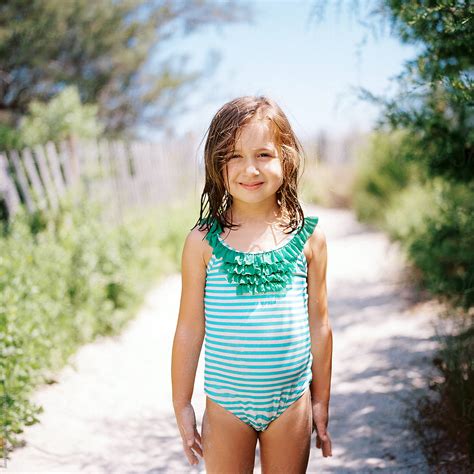 Cute Babe Girl Standing By A Beach Walkway In A Bathing Suit By Jakob