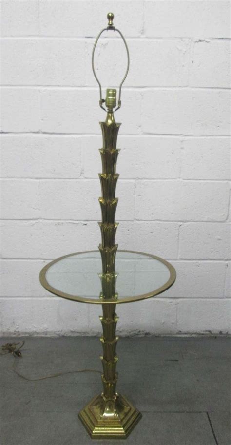 An original furniture piece eden center table is inspired in the mystic. Brass Palm Tree Floor Lamp at 1stdibs