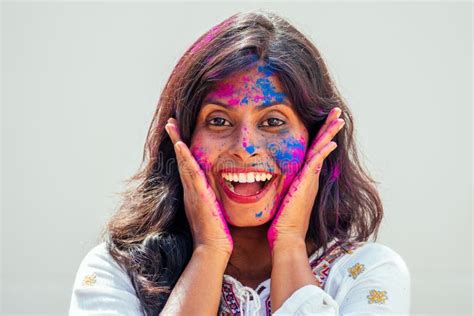 Holi Festival Of Colours Portrait Of Happy Indian Girl In Holi Color
