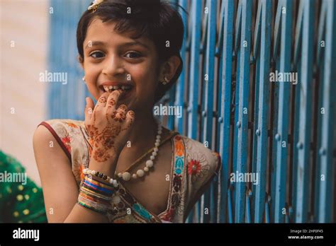 peshawar pakistan june 08 2020 smiling pakistani girl with cut dark hair and colorful dress