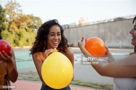 Adult Holding Balloons Photos Et Images De Collection Getty Images