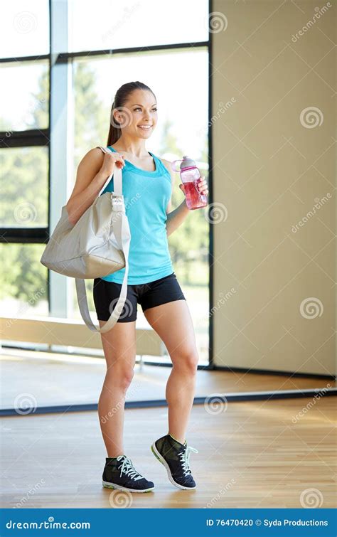Woman With Sports Bag And Bottle Of Water In Gym Stock Photo Image Of