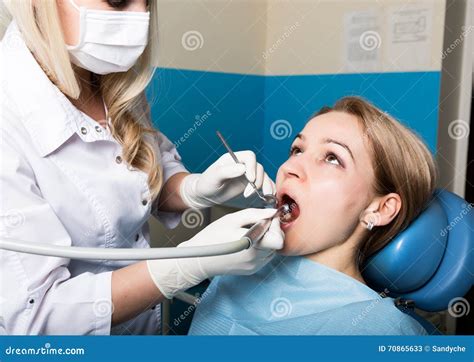 The Reception Was At The Female Dentist Doctor Examines The Oral