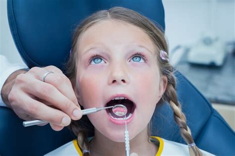 Premium Photo Close Up Of Girl Having Her Teeth Examined