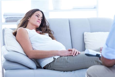 Sad Pregnant Woman Relaxing On Sofa At Home Prospan Arabia