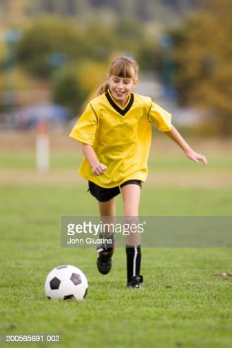 Girl Playing Football Smiling High Res Stock Photo Getty Images