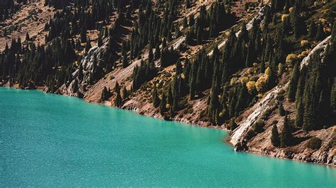 Brown Rocky Mountain Beside Blue Sea During Daytime Hd Wallpaper Peakpx