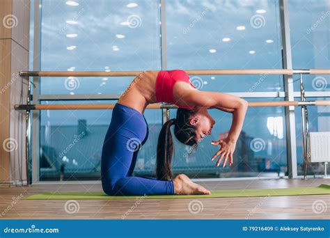 Young Woman Doing Yoga Exercises On Mat At Gym Stock Image Image Of