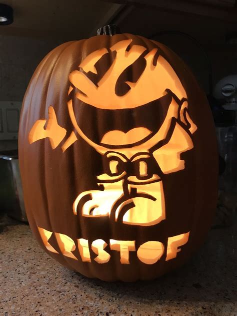 A Pumpkin Carved To Look Like It Has An Image Of A Cartoon Character On It