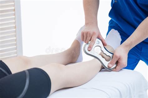 The Doctor Makes A Massage With The Blade Tool Increased Mobility Of