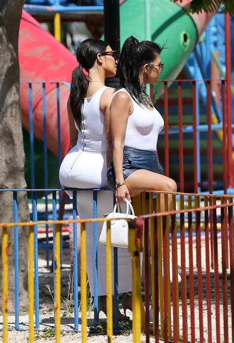 bootylicious kim kardashian exposes larger than ever butt in sexy skintight white dress