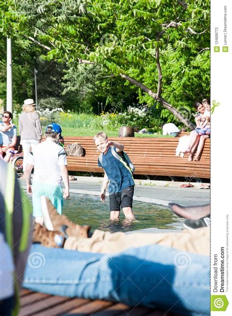 Yakimanskaya Embankment During The Midday Locals Enjoy Sunny Day In