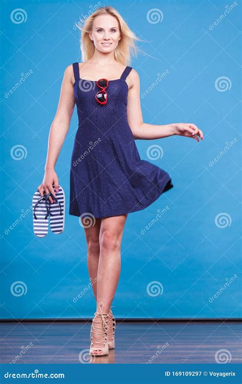 Woman Wearing Short Dress Holding Flip Flops And Sunglasses Stock Image Image Of Navy